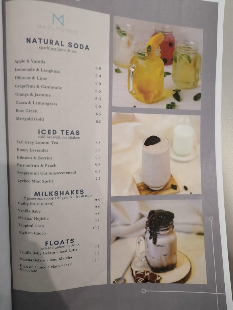 A menu displaying various drinks like sodas, iced teas, milkshakes, and floats with prices.