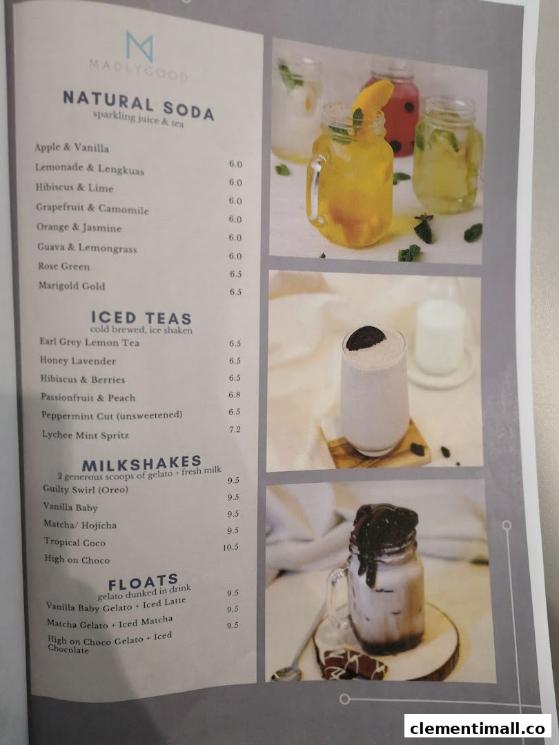 A menu displaying various drinks like sodas, iced teas, milkshakes, and floats with prices.