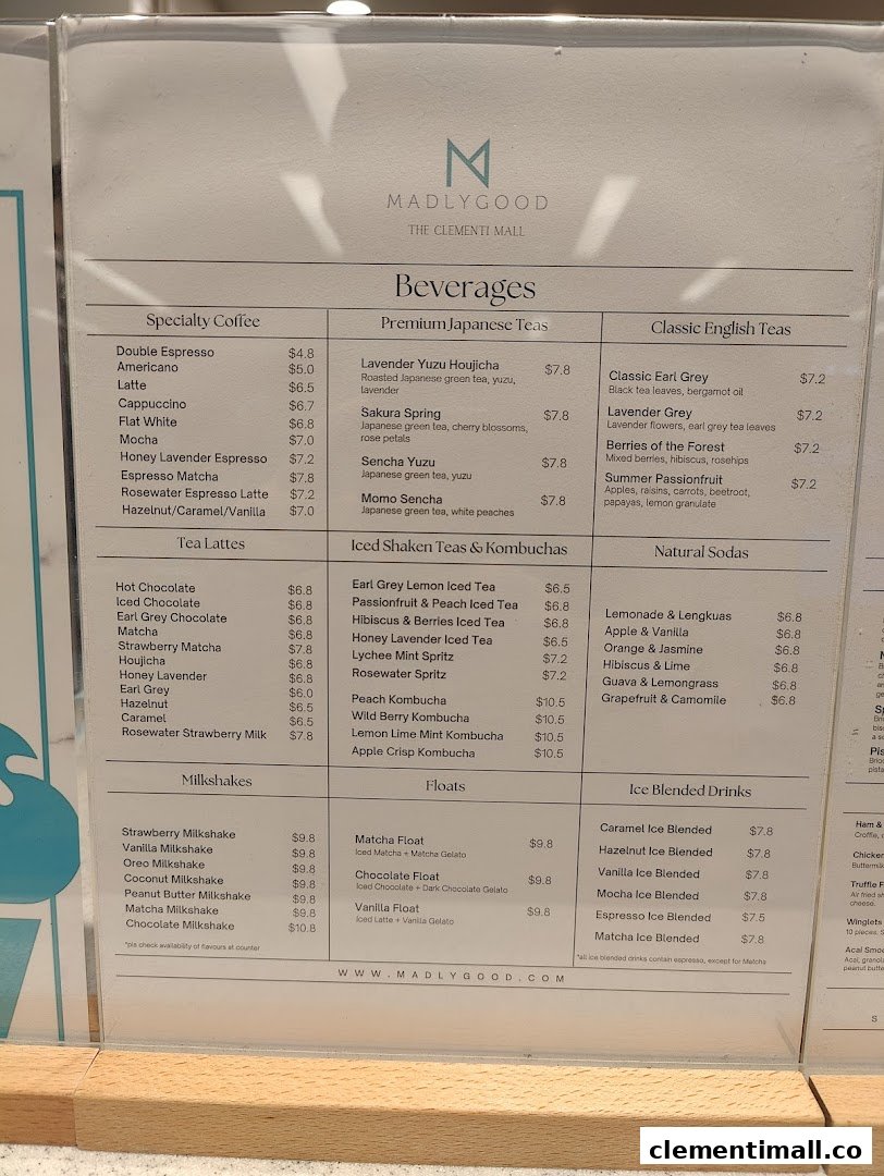 A detailed menu board for MADLYGOOD, showcasing a variety of beverages and desserts.