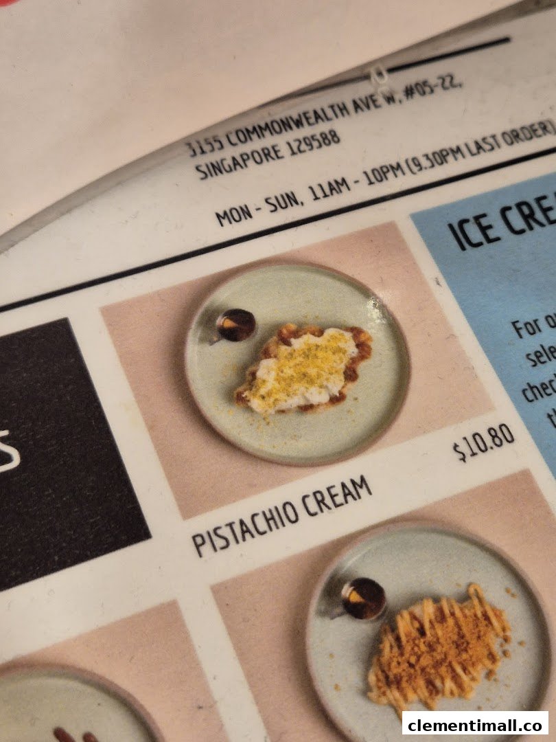 Close-up of MADLYGOOD's menu showing Pistachio Cream dessert, price, address, and operating hours.