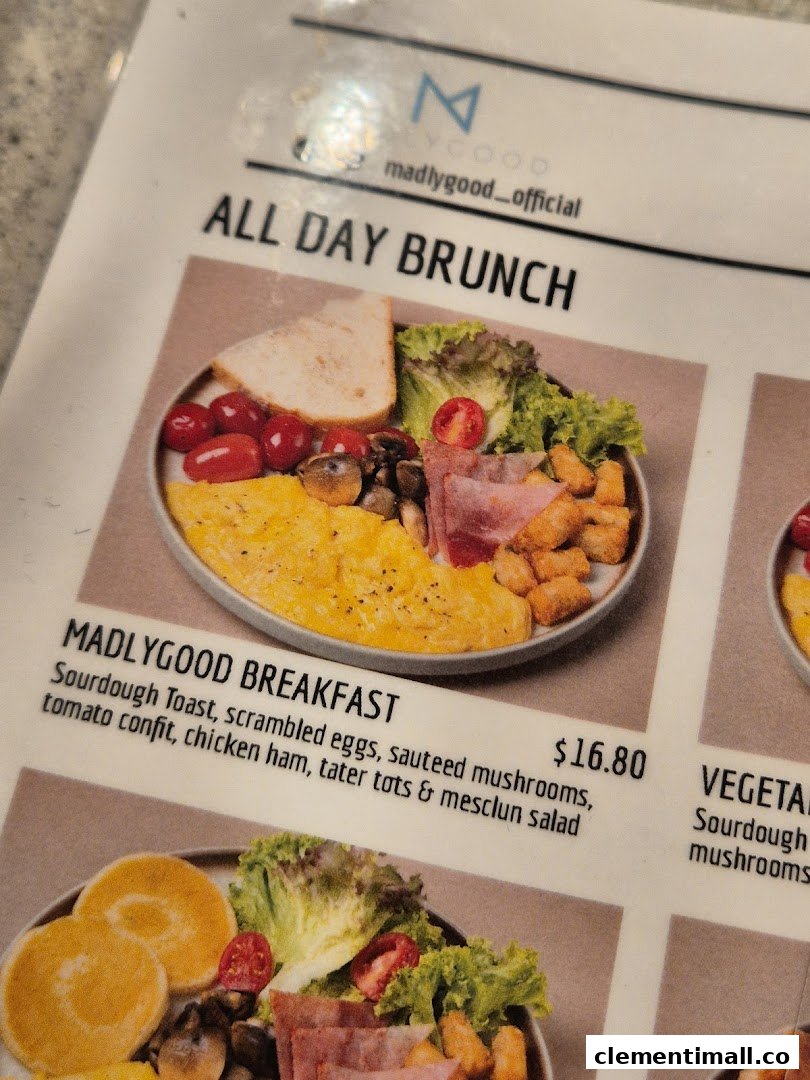 A close-up of MADLYGOOD's menu, showcasing the 'All Day Brunch' section with the 'Madlygood Breakfast' item.
