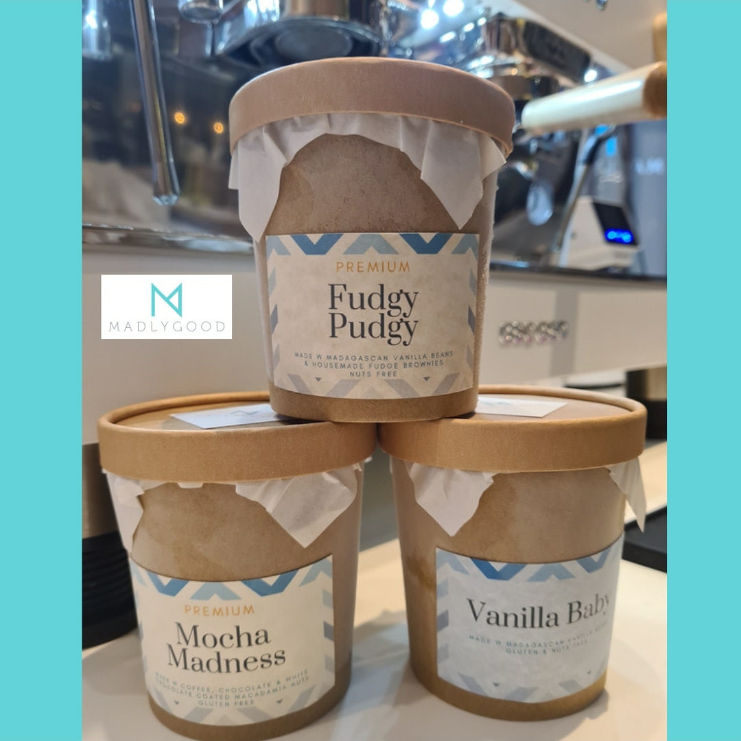 Three premium dessert tubs from MADLYGOOD, showcasing Fudgy Pudgy, Mocha Madness, and Vanilla Baby flavors.