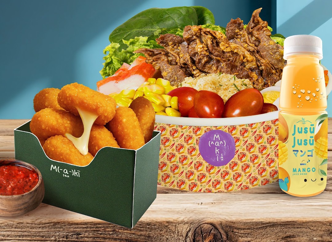A vibrant spread of Maki-San's customizable bowl, cheesy bites, and a refreshing mango juice.