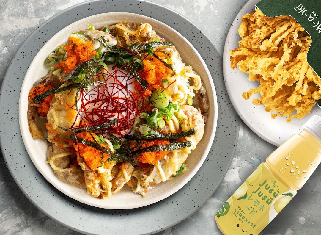 A vibrant bowl of Japanese food with fried mushrooms and a yuzu lemonade drink.