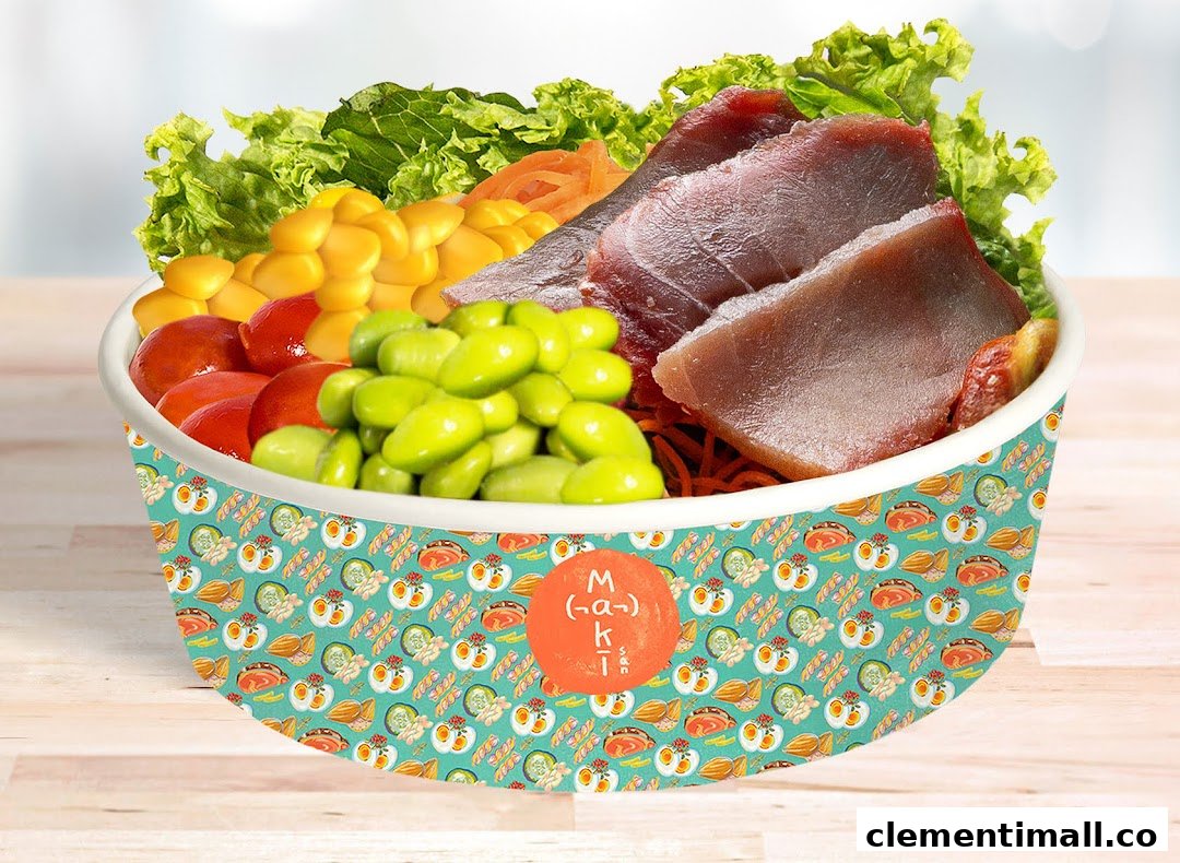 A vibrant poke bowl filled with fresh tuna, edamame, corn, tomatoes, and greens.