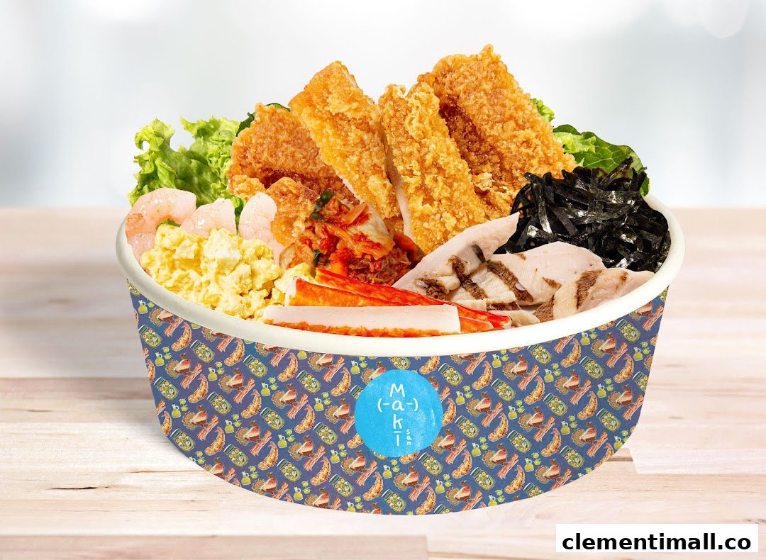 A vibrant custom food bowl from Maki-San, featuring fried chicken, shrimp, eggs, kimchi, and other fresh ingredients.
