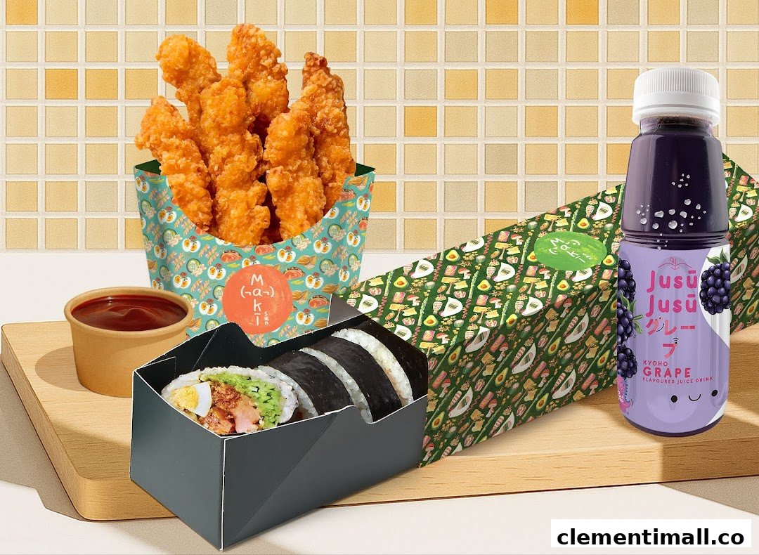 A Maki-San sushi roll, fried chicken, and a grape drink are displayed on a wooden board.