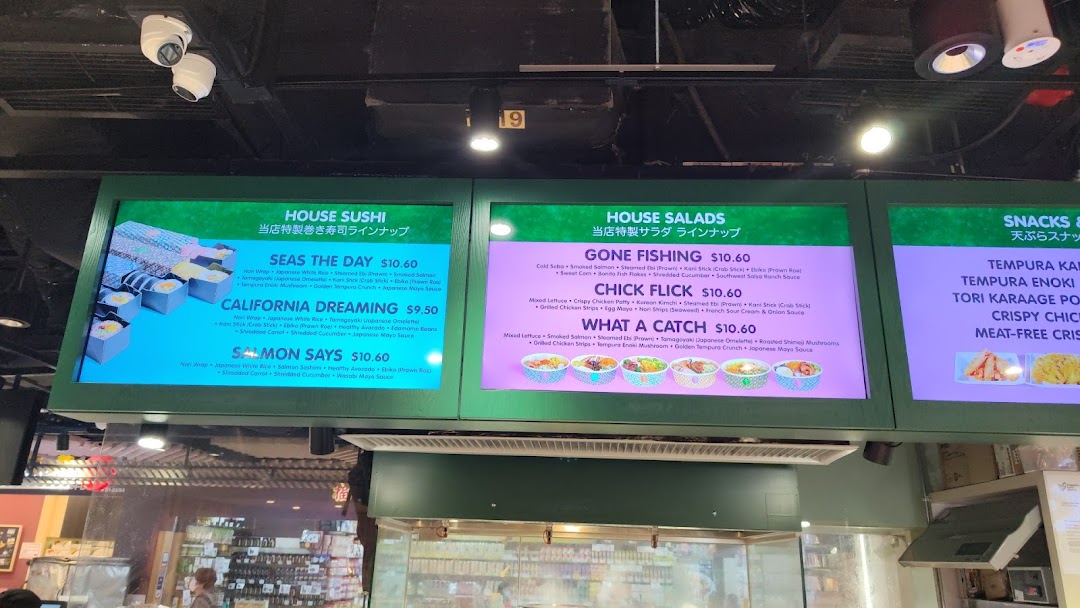 Digital menu boards displaying sushi, salads, and snacks with prices and ingredients at Maki-San.