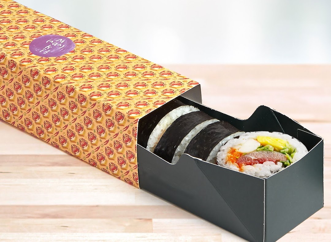 Assorted sushi rolls presented in a vibrant Maki-San takeaway box.