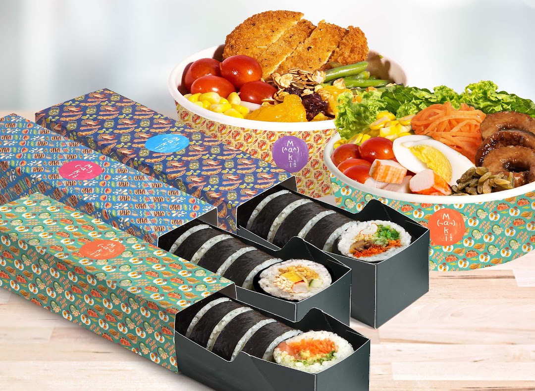 Assortment of Maki-San's customizable sushi rolls in colorful boxes and fresh salad/rice bowls.