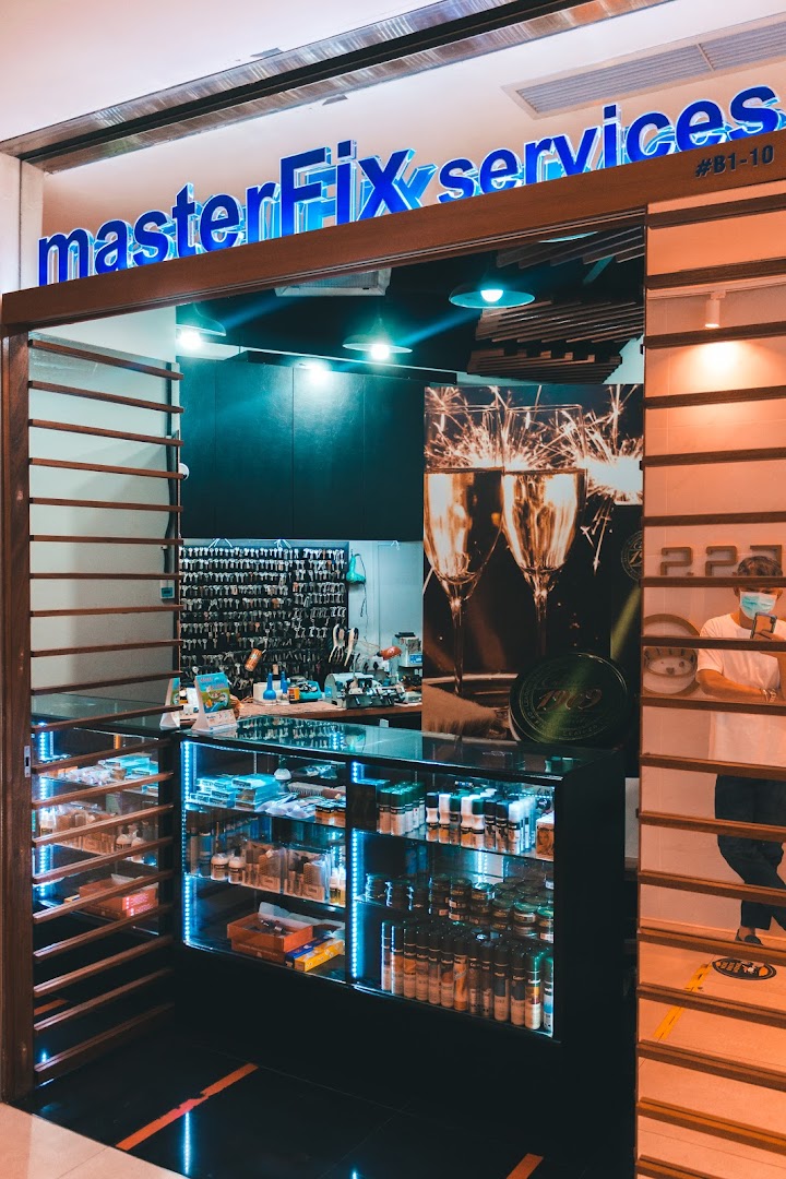 The storefront of MasterFix services, featuring a display counter and key duplication area.
