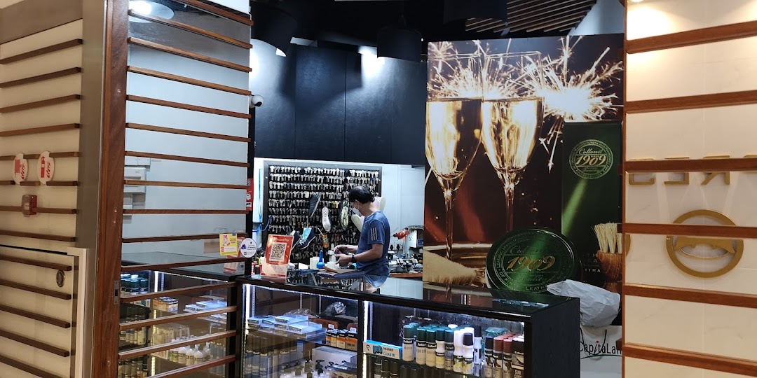 Interior view of MasterFix Clementi, showing a staff member at the counter, key cutting services, and shoe care products.