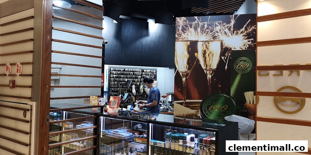 Interior view of MasterFix Clementi, showing a staff member at the counter, key cutting services, and shoe care products.