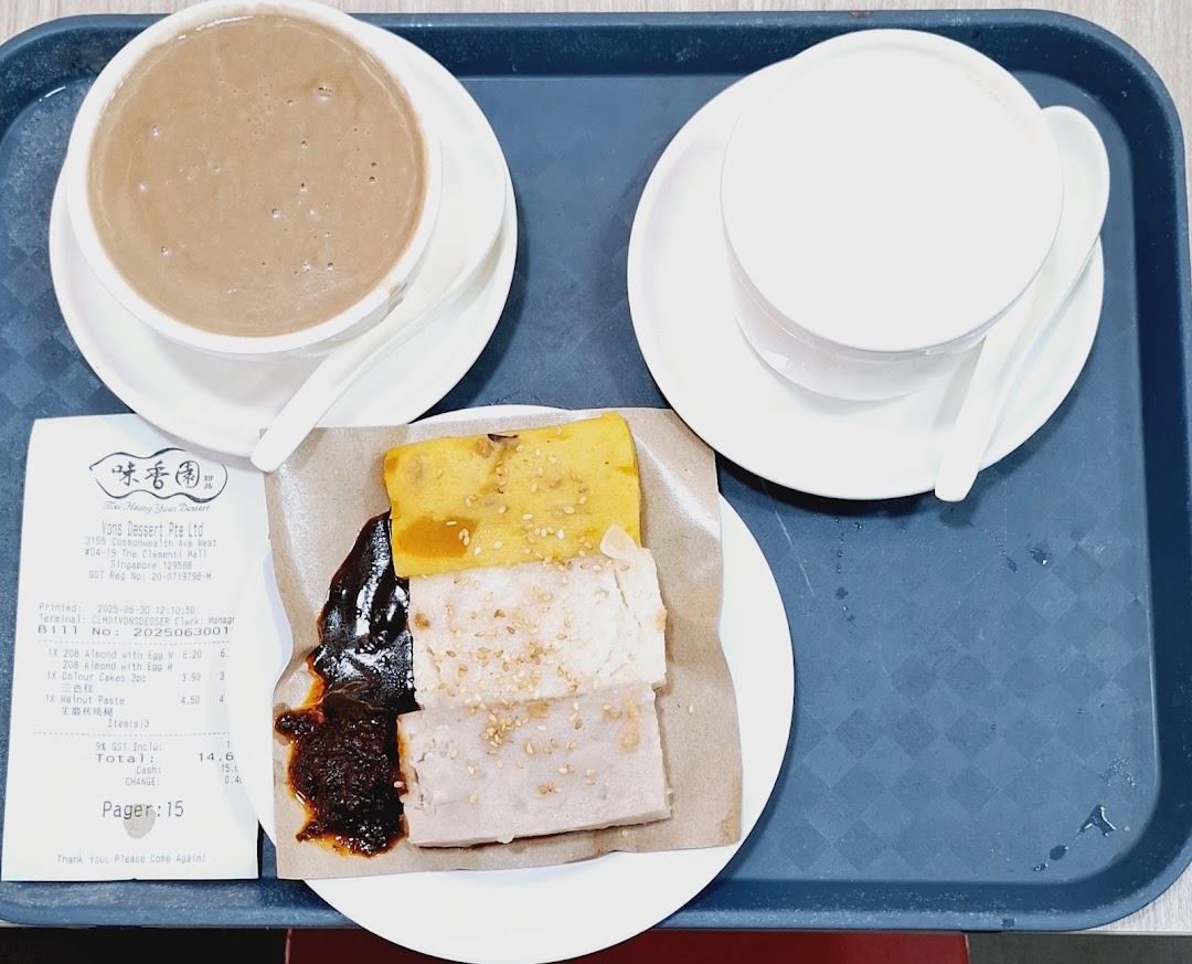 A tray with traditional Chinese desserts, including almond paste, walnut paste, and three-color cakes, alongside a receipt.