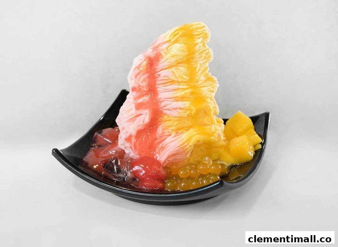A vibrant shaved ice dessert with fruit, jelly, and popping boba in a black bowl.