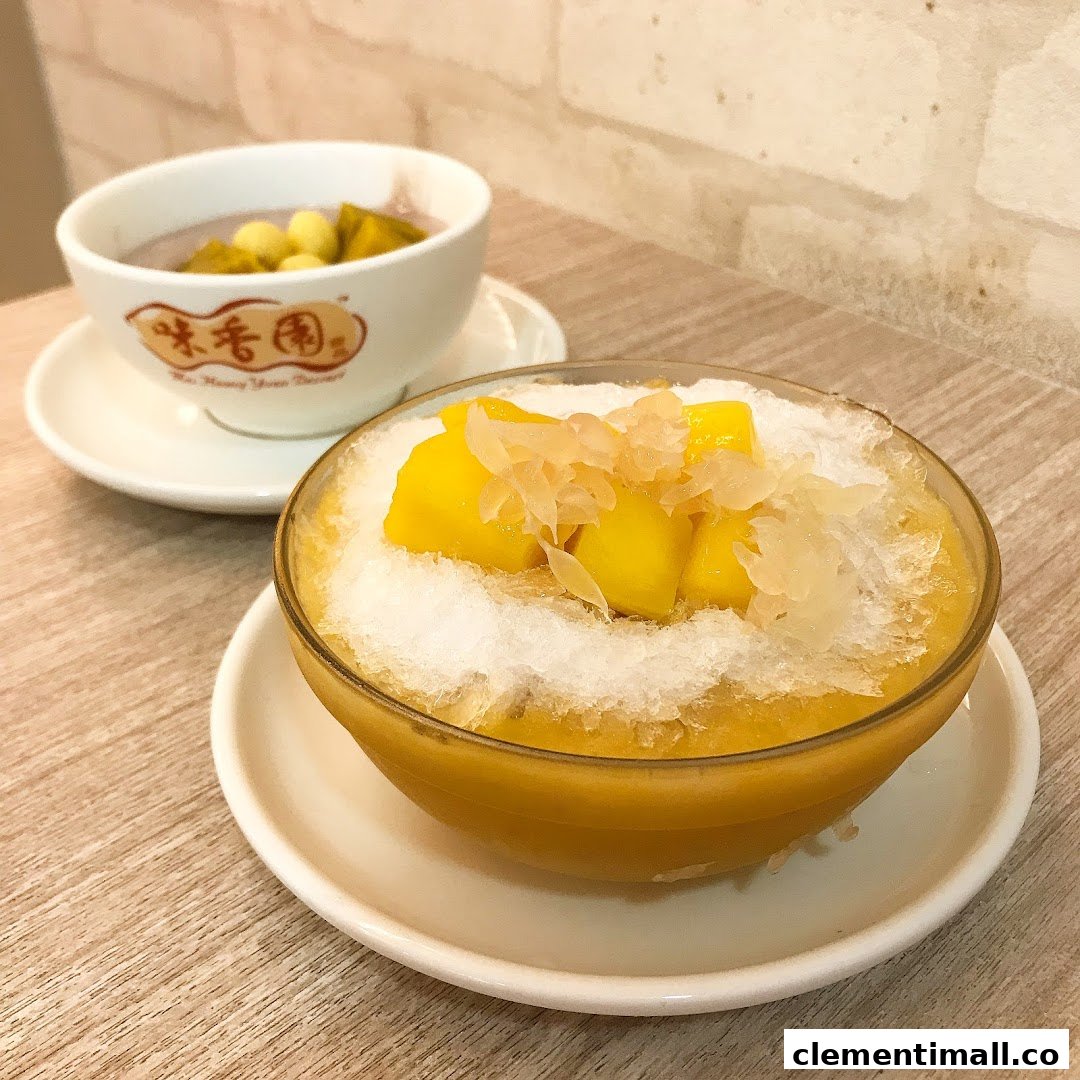 Two bowls of traditional Chinese desserts, including mango shaved ice and a taro-based soup.