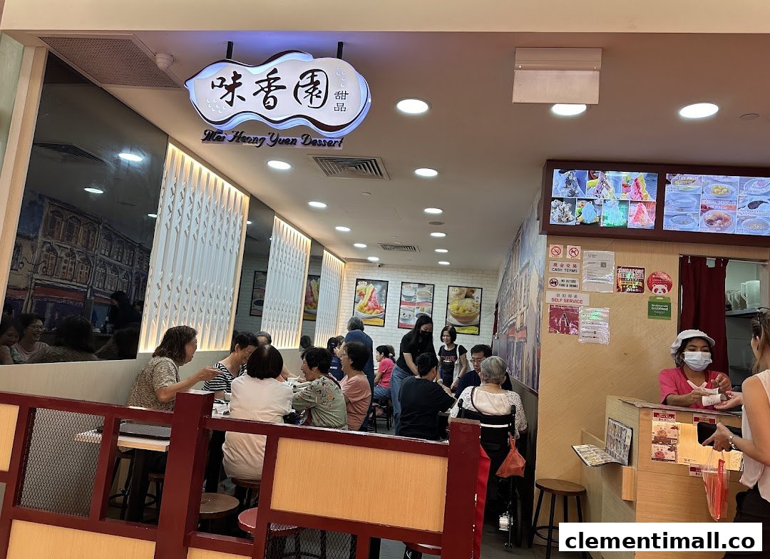 Bustling interior of Mei Heong Yuen Dessert, showing customers enjoying treats and staff at the counter.