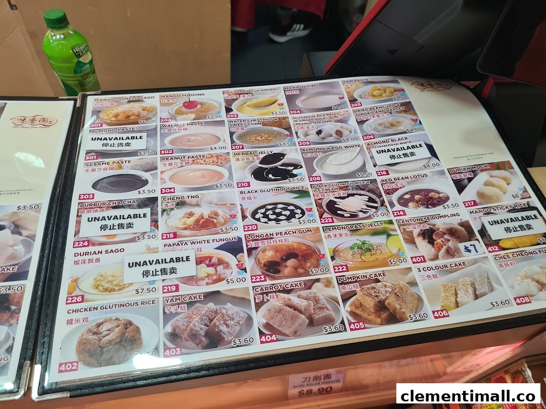 A detailed menu board displaying various traditional Asian desserts and snacks with prices.