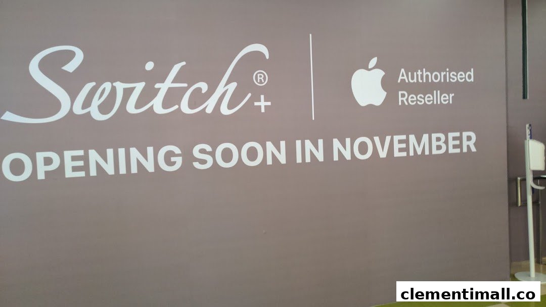 A large wall sign for Switch+, an Apple Authorised Reseller, announcing its opening soon in November.
