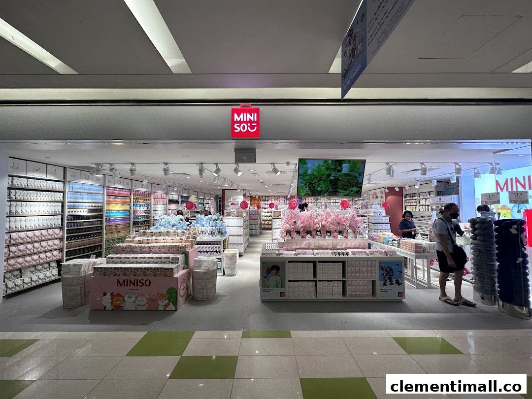 The MINISO store entrance at Clementi Mall, showcasing a wide array of colorful products and displays.