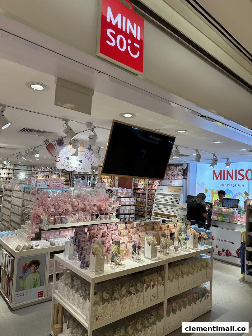 Interior view of MINISO store showcasing diverse products, displays, and checkout area.
