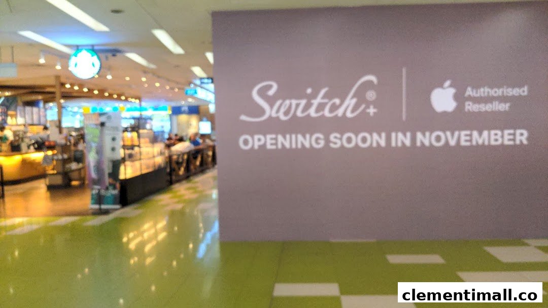A mall scene featuring a 'Switch+' Apple Reseller 'Opening Soon' sign, with a Starbucks store in the background.