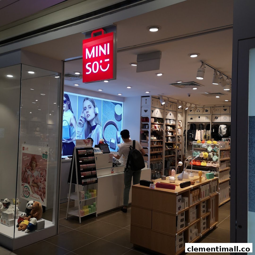 The MINISO shop entrance features a bright red sign and a view of its diverse product displays.