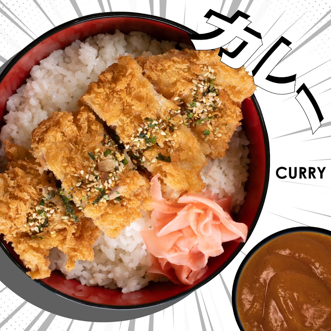 A vibrant image of crispy katsu over rice with pickled ginger and a side of rich curry.