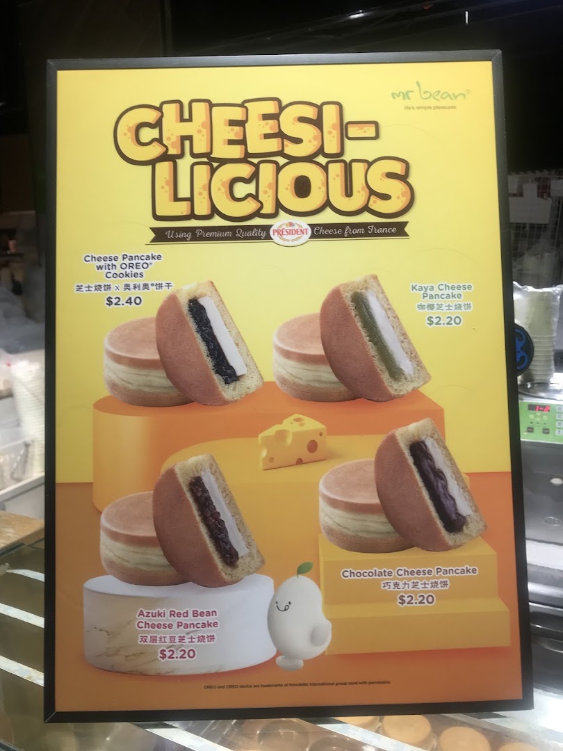 A promotional poster from Mr Bean showcasing their 'Cheesi-licious' range of cheese pancakes.
