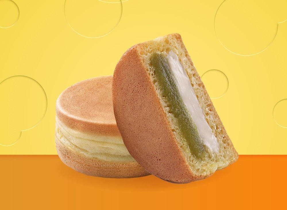 Delicious Mr Bean pancakes with creamy green and white filling on a vibrant background.