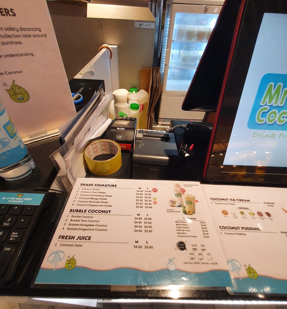 A close-up of Mr Coconut's menu board, showcasing various coconut-based drinks and desserts.