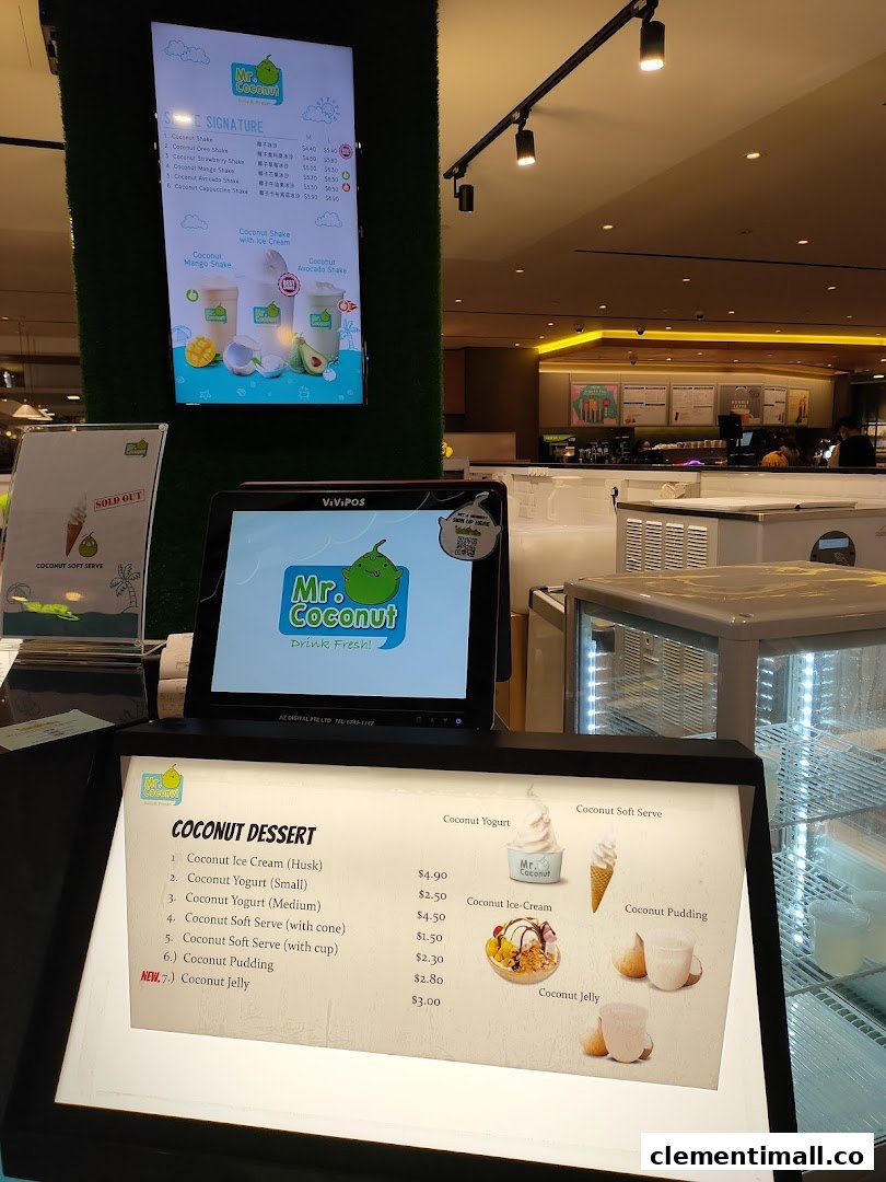 A close-up view of Mr Coconut's digital and lighted menus displaying various coconut drinks and desserts.