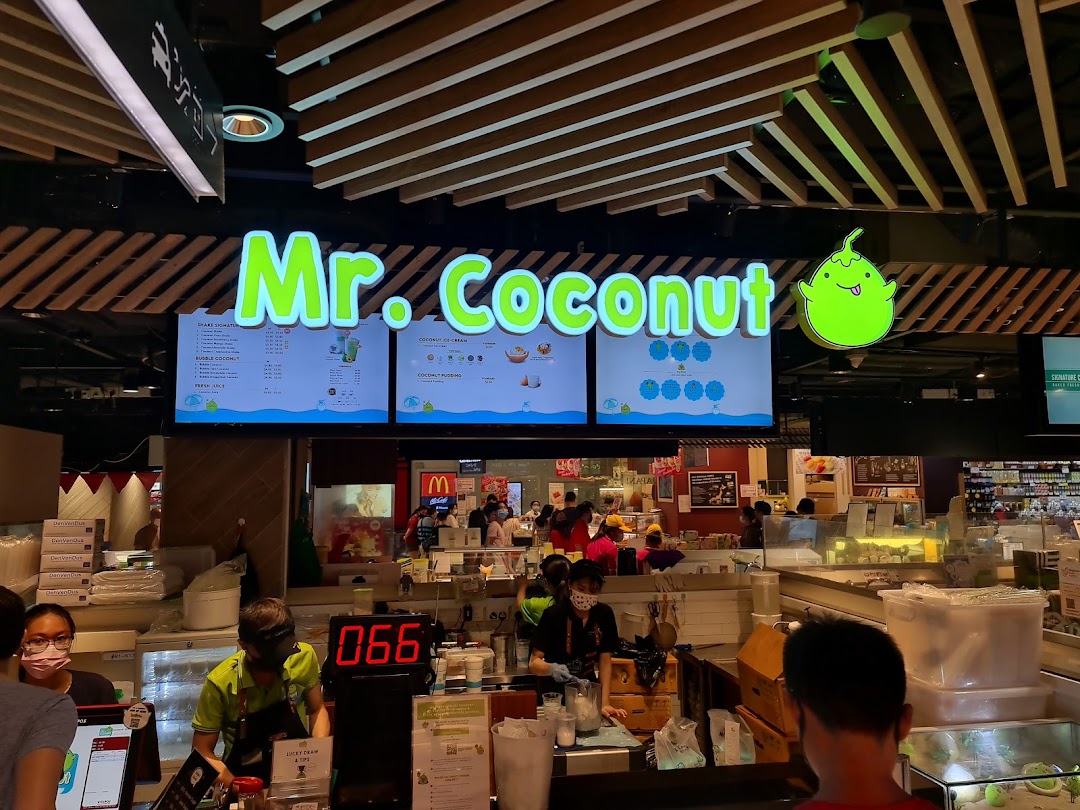 Digital menu boards displaying a variety of coconut-based drinks and desserts at Mr Coconut.