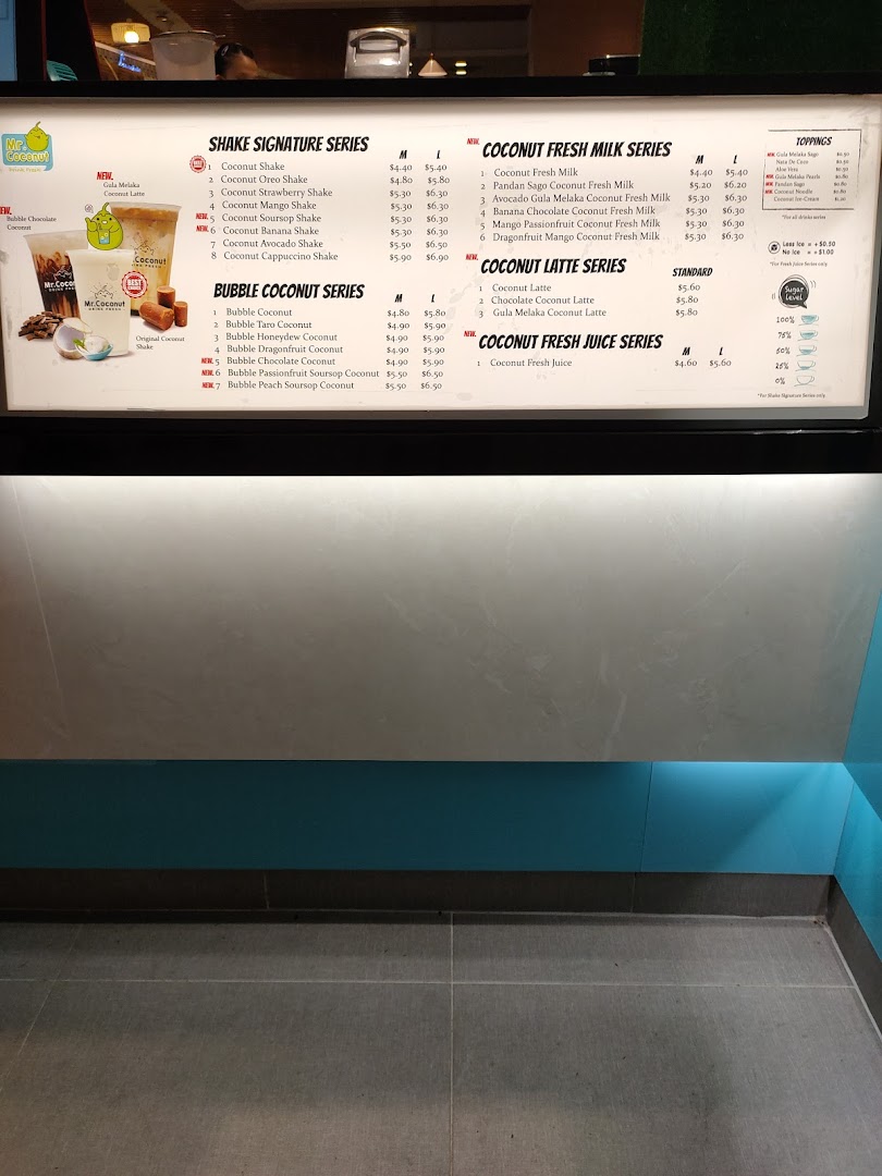 A detailed menu board displaying various coconut-based drinks and toppings at Mr Coconut.