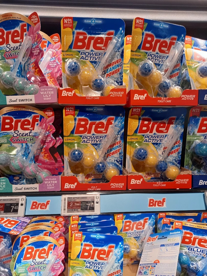 A retail display of Bref toilet cleaning products, including Power Active and Scent Switch.