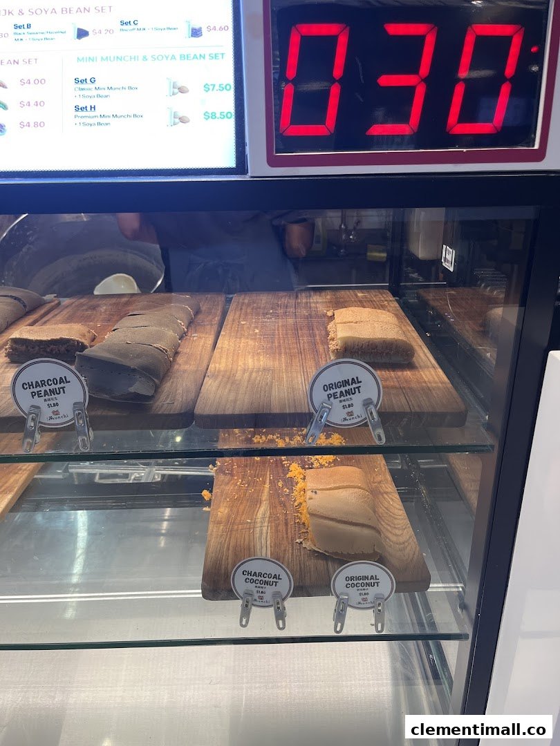 A vibrant display of Munchi Pancakes in various flavors, with a menu board showing sets.