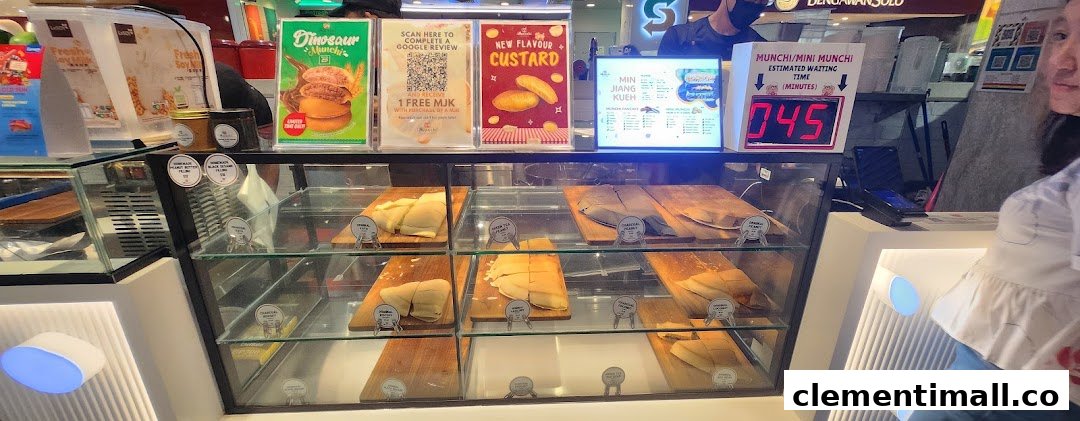 A vibrant counter at Munchi Pancakes showcasing various pancake flavors and promotional displays.