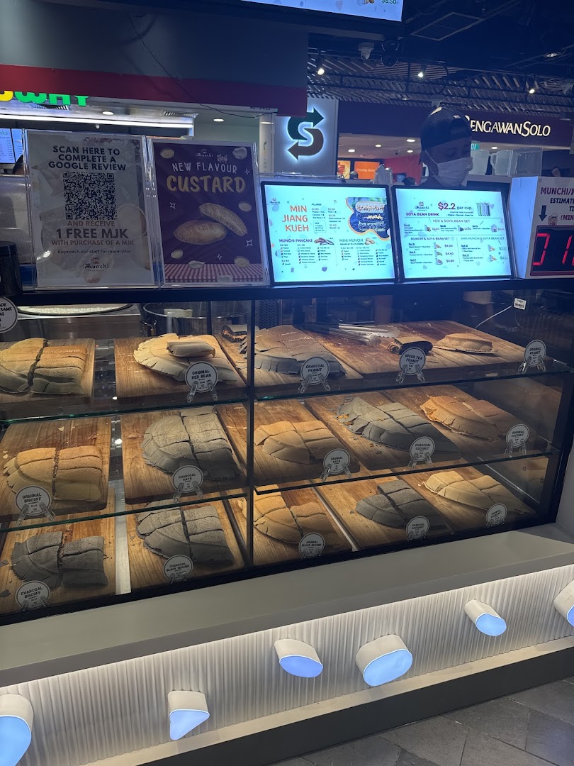 A vibrant display counter at Munchi Pancakes showcasing various traditional and modern pancake flavors.
