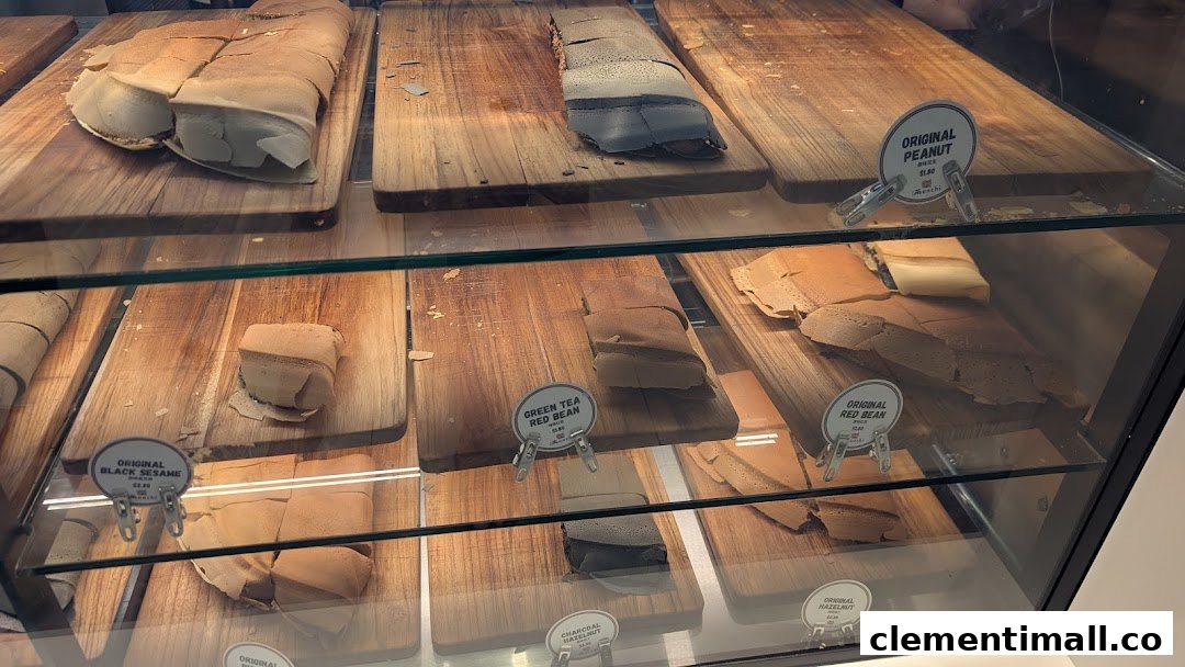 A display case showcasing various Munchi Pancakes with different fillings and prices.
