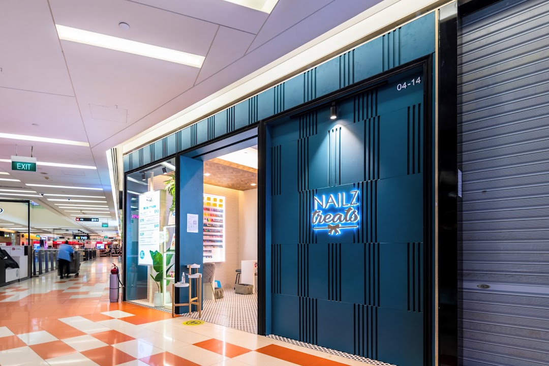 The vibrant blue entrance of Nailz Treats, a nail salon, located within The Clementi Mall.
