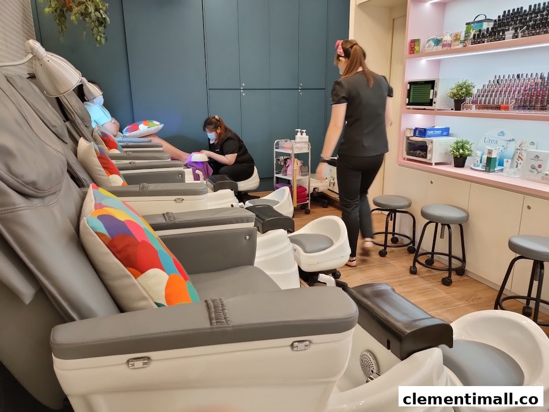 Customers receiving nail treatments in a modern salon with comfortable chairs and product displays.