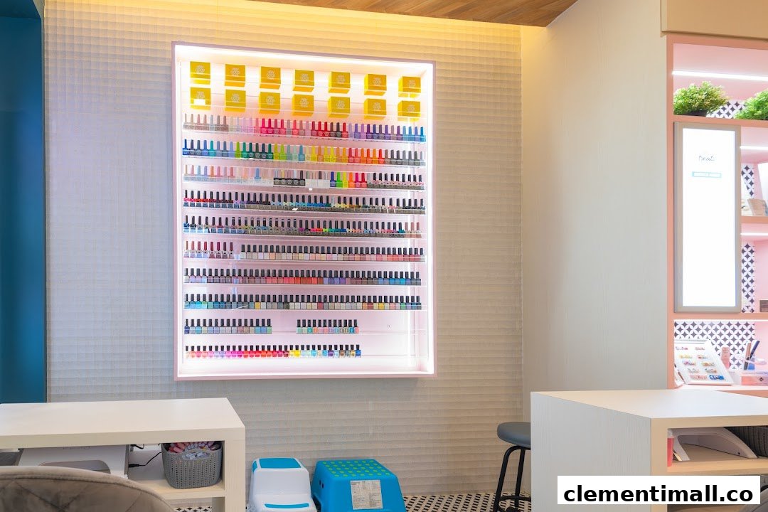 Interior view of a nail salon featuring a large, illuminated display of colorful nail polishes.