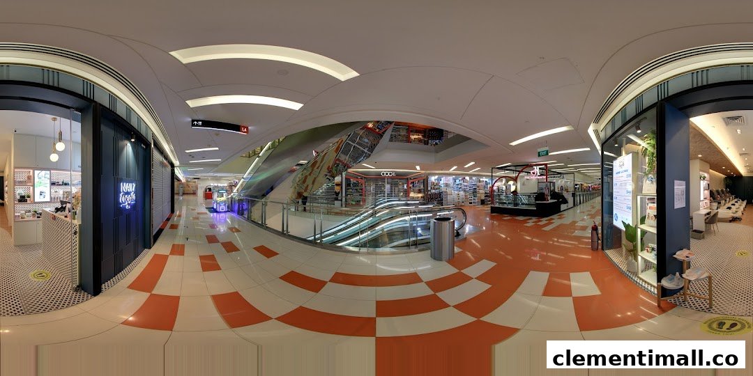 Panoramic view of a shopping mall interior featuring Nailz Treats and escalators.