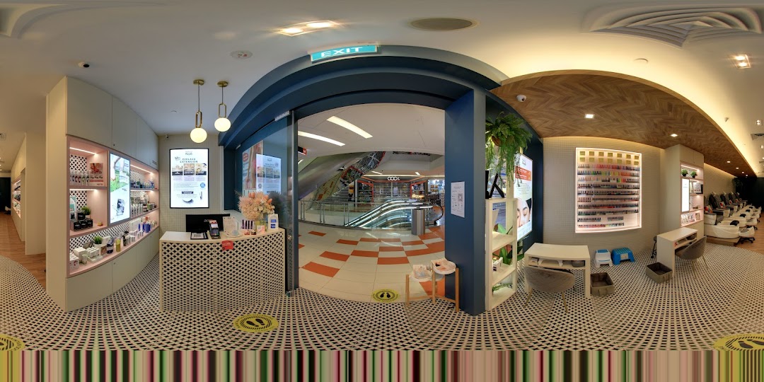 Interior view of Nailz Treats salon, featuring reception, product displays, and nail service stations.