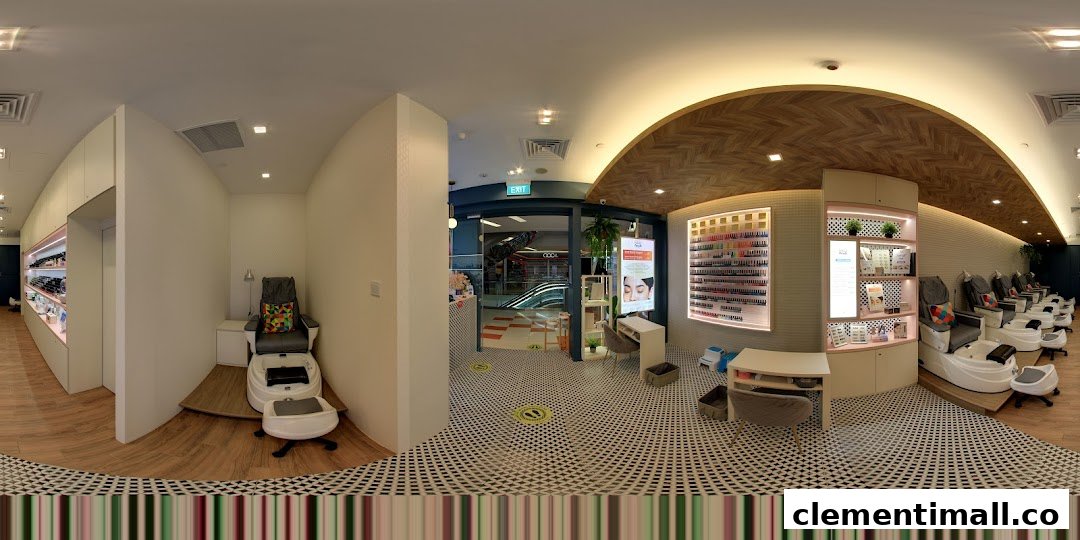 Interior view of a modern nail salon with pedicure stations and nail polish displays.