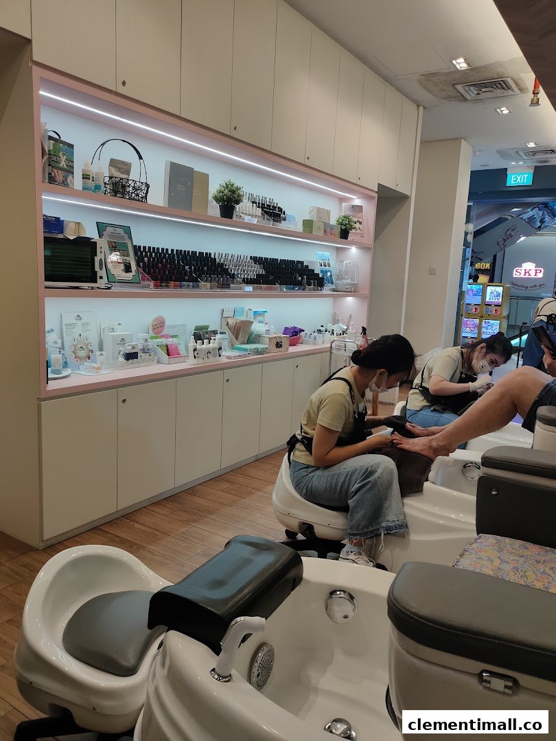Interior view of Nailz Treats salon showing customers receiving pedicure services and product displays.