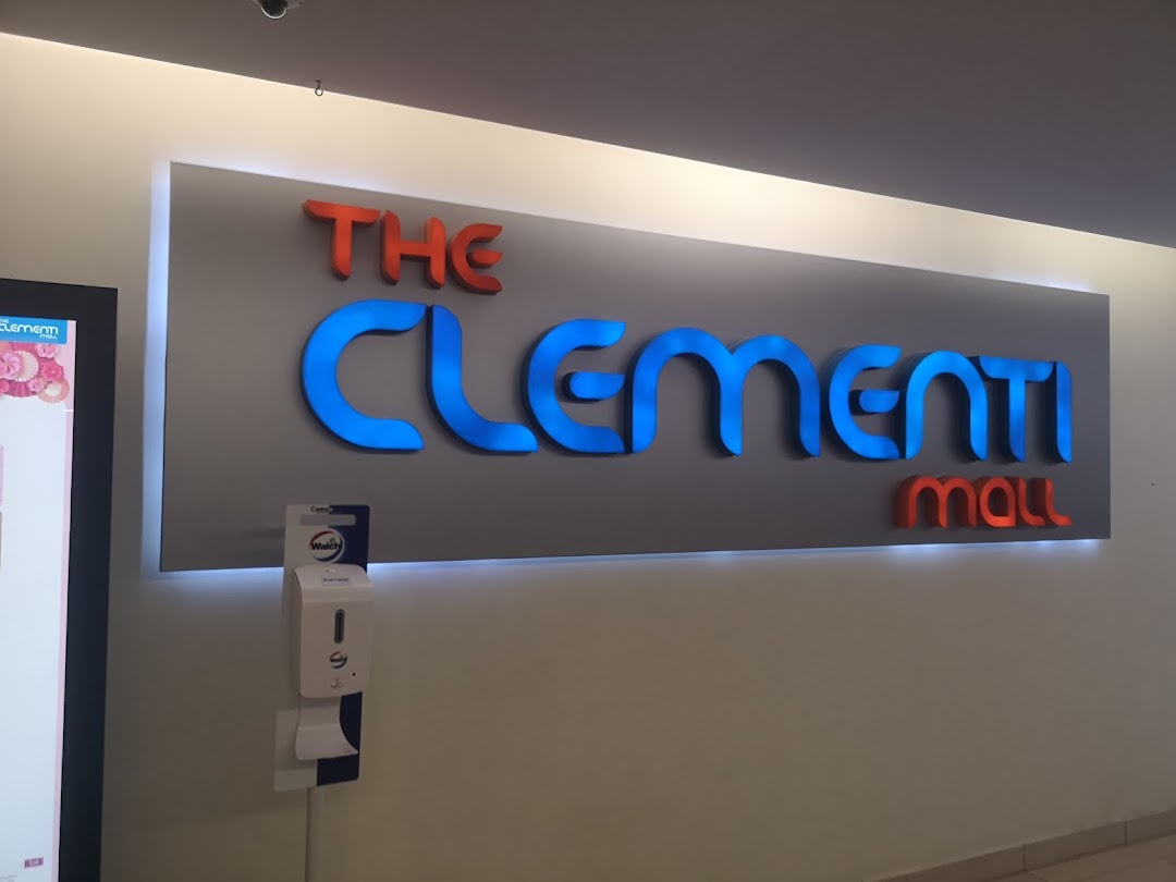 An illuminated sign for 'The Clementi Mall' with a hand sanitizer dispenser below.