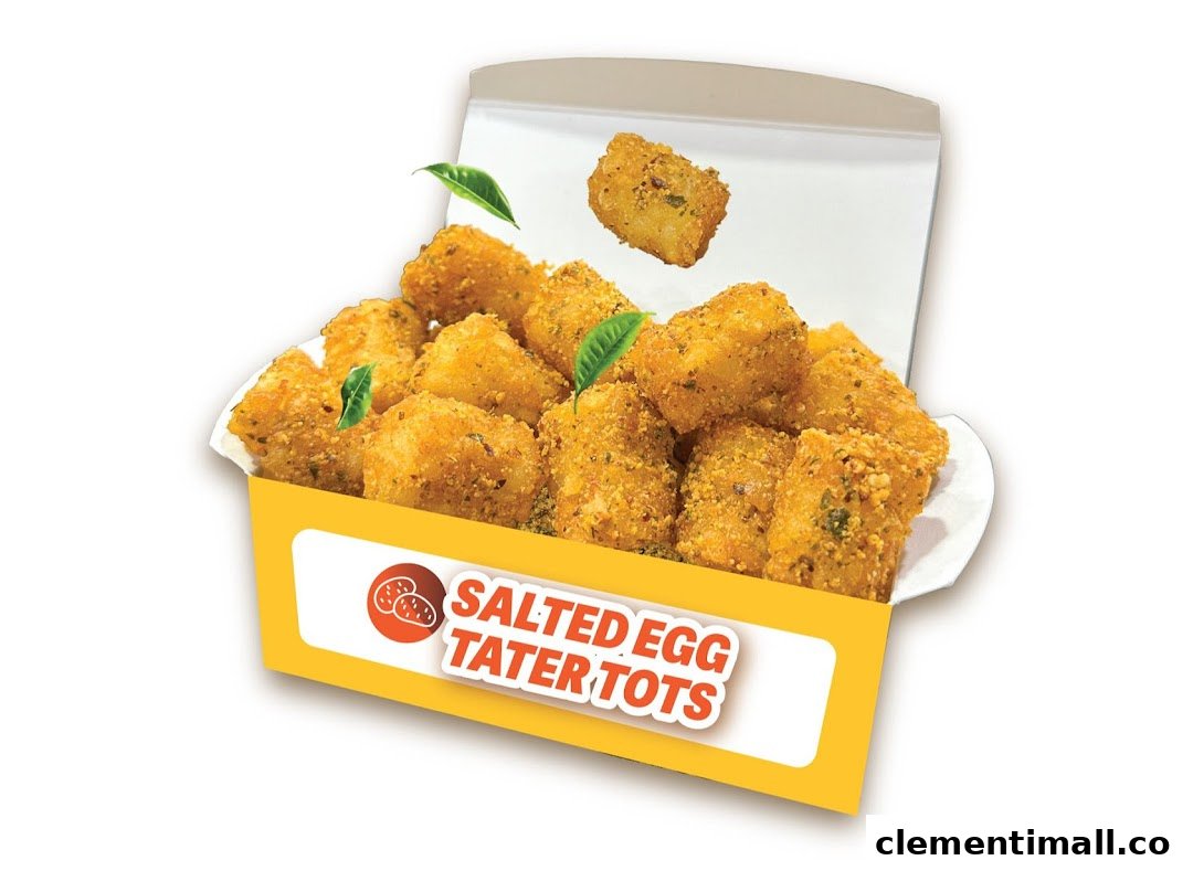A vibrant image of golden-brown salted egg tater tots in a yellow and white box.