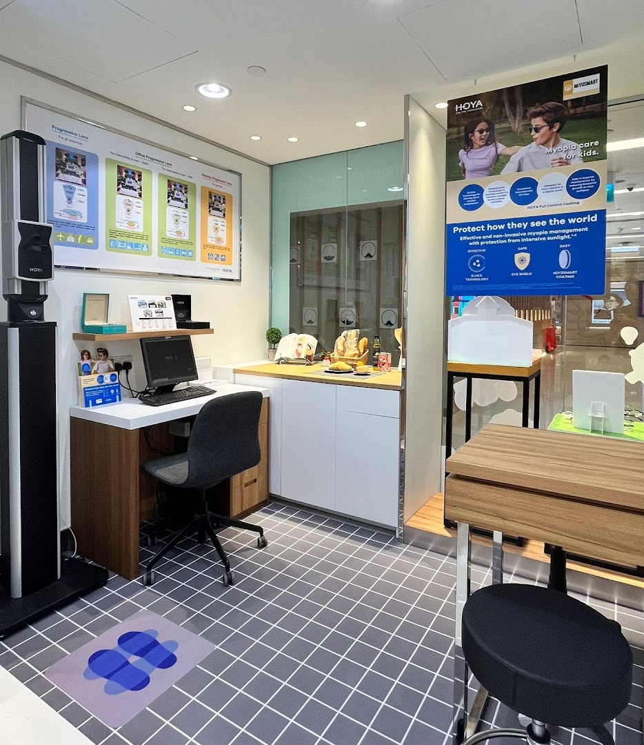 An interior view of Optical 88, featuring a consultation desk, eye examination equipment, and display posters.