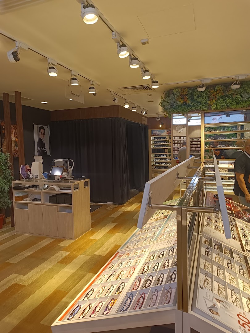 Interior view of OWNDAYS Clementi Mall, showcasing eyewear displays, reception, and fitting areas.